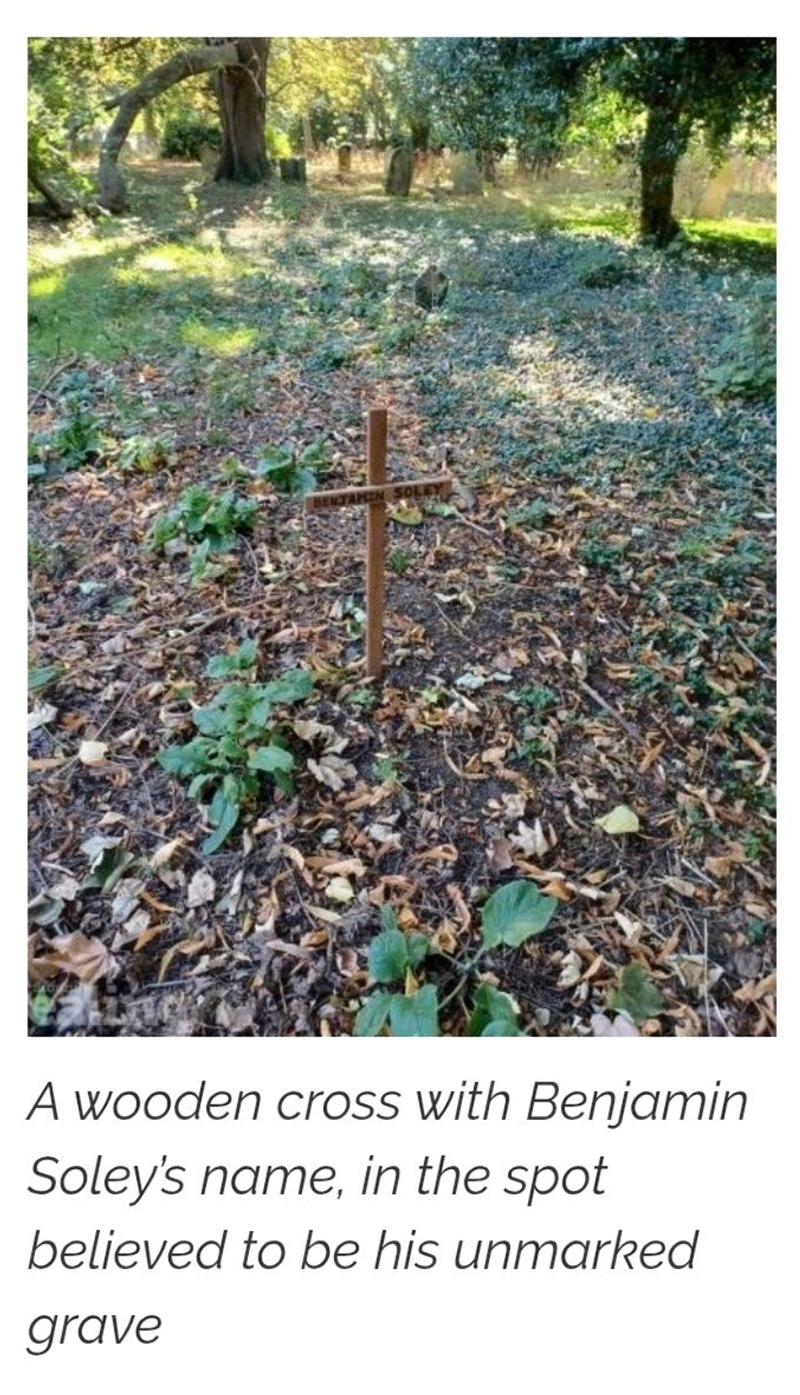 Wooden cross marking Benjamin Soley's unmarked grave